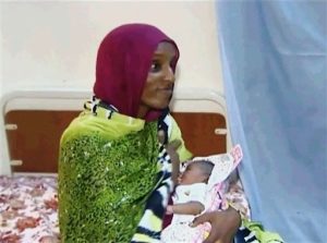 FILE - In this file image made from an undated video provided Thursday, June 5, 2014, by Al Fajer, a Sudanese nongovernmental organization, Meriam Ibrahim breastfeeds her newborn baby girl that she gave birth to in jail last week, as the NGO visits her in a room at a prison in Khartoum, Sudan. Sudan's official news agency, SUNA, said the Court of Cassation in Khartoum on Monday, June 23, canceled the death sentence against 27-year-old Meriam Ibrahim after defense lawyers presented their case. The court ordered her release. (AP Photo/Al Fajer, File)