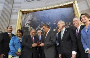 House Speaker John Boehner of Ohio, presents Lonnie Bunch III with a Congressional Gold Medal in honor of the late  Dr. and Mrs. Martin Luther King, Jr., who were instrumental in the passage of the Civil Rights Act of 1964, Tuesday, June 24, 2014, during a 50th anniversary ceremony of the law in the Capitol Rotunda on Capitol Hill in Washington. From left are, Dexter King, Bernice King, Bunch, Sen. Carl Levin, D-Mich., Boehner, Rep. Marcia Fudge, D-Ohio, Senate Majority Leader Harry Reid of Nev., Senate Minority Leader Mitch McConnell of Ky., and House Minority Leader Nancy Pelosi of Calif.  (AP Photo/Susan Walsh)