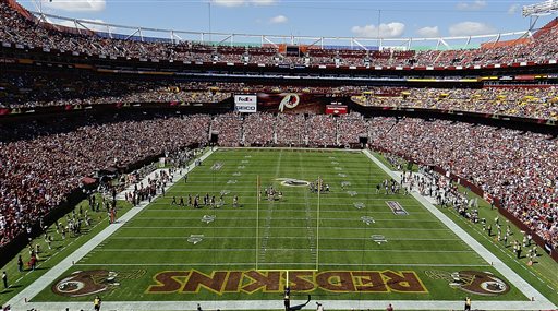 In this Sept. 24, 2012, file photo, the Washington Redskins and Cincinnati Bengals face off during the first half of an NFL football game in Landover, Md. The U.S. Patent Office ruled Wednesday, June 18, 2014, that the Washington Redskins nickname is "disparaging of Native Americans" and that the team's federal trademarks for the name must be canceled. The ruling comes after a campaign to change the name has gained momentum over the past year. (AP Photo/Alex Brandon, File)