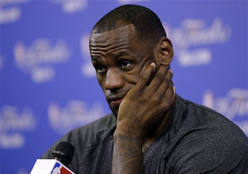 Miami Heat's LeBron James listens to a question during an NBA basketball media availability at the NBA Finals, Wednesday, June 11, 2014, in Miami. The San Antonio Spurs lead the Heat 2-1 in the best-of-seven games series. (AP Photo/Lynne Sladky)