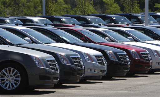 This July 14, 2010, file photo shows Cadillac CTS vehicles being displayed outside the LaFountaine Cadillac in Highland Township, Mich.  General Motors safety crisis worsened on Monday, June 30, 2014, when the automaker added 8.2 million vehicles to its huge list of cars recalled over faulty ignition switches. The latest recalls cover seven vehicles, including the Chevrolet Malibu from 1997 to 2005 and the Pontiac Grand Prix from 2004 to 2008. The recalls also cover a newer model, the 2003-2014 Cadillac CTS. GM said the recalls are for unintended ignition key rotation. (AP Photo/Carlos Osorio, File)