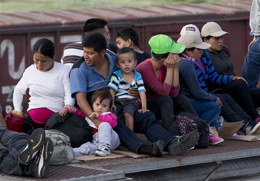 In this July 12, 2014, photo, Central American migrants ride a freight train during their journey toward the U.S.-Mexico border in Ixtepec, Mexico.   The last time so few people were arrested at the countrys borders was 1973, when the Border Patrol recorded just fewer than 500,000 arrests. And the volume of people being arrested at the border remains dramatically lower than the all-time high of more than 1.6 people in 2000.  (AP Photo/Eduardo Verdugo)