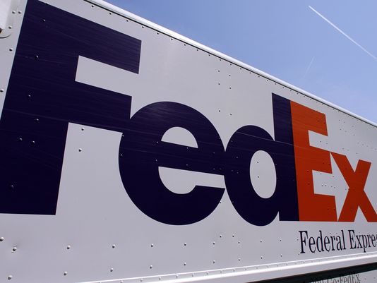 A FedEx delivery truck is seen at the Illinois State Capitol Wednesday, May 16, 2012 in Springfield, Ill. (AP Photo/Seth Perlman) 