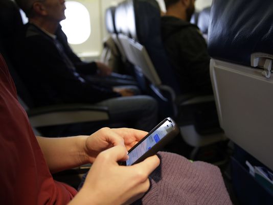 Passengers are still not allowed to text or make cellphone calls. (Matt Slocum/AP)