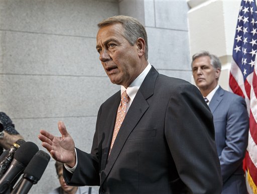 Speaker of the House John Boehner of Ohio, joined at right by incoming Majority Leader Rep. Kevin McCarthy of Calif., talks with reporters on Capitol Hill in Washington, Wednesday, July 23, 2014, following a Republican strategy session. House Republicans want to slash President Barack Obama's emergency spending request for the border, speed young migrants back home to Central America, and send in the National Guard.  (AP Photo/J. Scott Applewhite)
