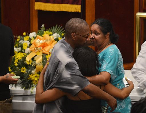 Esaw Garner, right, is consoled by family members at the funeral for her husband, Eric Garner, at Bethel Baptist Church in the Brooklyn borough of New York on Wednesday, July 23, 2014. Garner died in police custody after an officer placed him in an apparent chokehold. (AP Photo/New York Daily News, Julia Xanthos, Pool)