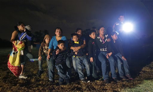 In this June 25, 2014 file photo, a group of immigrants from Honduras and El Salvador who crossed the U.S.-Mexico border illegally are stopped in Granjeno, Texas. Many of the immigrants recently flooding the nations southern border say theyre fleeing violent gangs in Central America. These gangs were a byproduct of U.S. immigration and Cold War policies, specifically growing from the increase in deportations in the 1990s. With weak dysfunctional governments at home, U.S. street gang culture easily took hold and flourished in these countries. (AP Photo/Eric Gay)