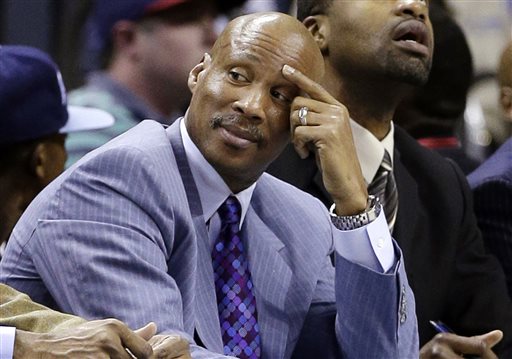 In this April 17, 2013, file photo, then-Cleveland Cavaliers coach Byron Scott watches an NBA basketball game in Charlotte, N.C. Scott said this weekend that he has been hired by the Los Angeles Lakers, but the club insisted Sunday, July 27, 2014, that no deal has been reached. Scott, who won three NBA titles as a shooting guard for the Lakers, told KCBS-TV he will take over the club, which hasn't had a coach since Mike D'Antoni resigned April 30. (AP Photo/Chuck Burton, File)