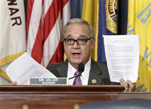FILE - In this July 24, 2014, file photo, House Veterans Affairs Committee Chairman Jeff Miller, R-Fla., holds up two pages of resource requests from the Department of Veterans Affairs on Capitol Hill in Washington. The chairmen of the House and Senate Veterans Affairs committees have reached a tentative agreement on a plan to fix a veterans' health program scandalized by long patient wait times and falsified records covering up delays. Rep. Jeff Miller, R-Fla., and Sanders scheduled a news conference Monday, July 28, to talk about a compromise plan to improve veterans' care. (AP Photo/File)