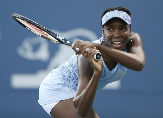 Venus Williams has a disease that causes fatigue and joint pain, but she's still having fun. (Beck Diefenbach/AP)