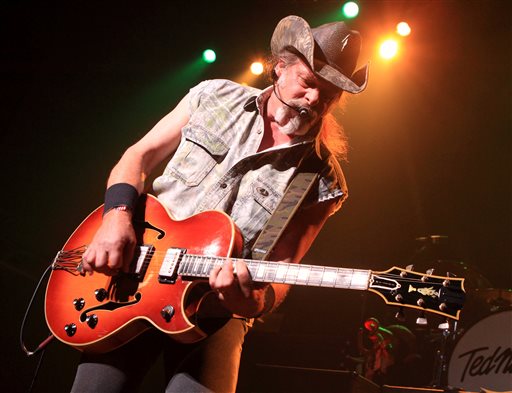 This Aug. 16, 2013 file photo shows Ted Nugent performing at Rams Head Live in Baltimore. A Native American tribe has canceled an Aug. 4, 2014, concert by Nugent at its casino. The Coeur d'Alene Tribe on Monday, July 21, 2014, said that the cancellation of the concert at the casino in Worley was because of what it called the rocker's "racist and hate-filled remarks.'' (Photo by Owen Sweeney/Invision/AP, File)