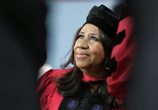 In a Thursday, May 29, 2014 file photo, singer Aretha Franklin looks up while seated on stage during Harvard University commencement ceremonies, in Cambridge, Mass. Franklin, the Queen of Soul says she's looking forward to tracking down one of the powdered sugar-covered confections while she's at the Ohio State Fair to perform on Thursday, July 31, 2014. (AP Photo/Steven Senne, File)