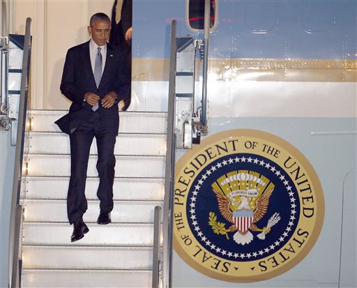 President Barack Obama walks down the stairs of Air Force One upon his arrival at San Francisco International Airport, Tuesday, July 22, 2014, in San Francisco. (AP Photo/Tony Avelar)