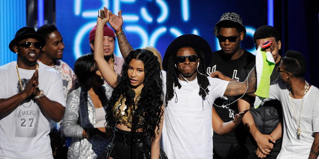 Nicki Minaj, Lil' Wayne, and Young Money accept the award for best group at the BET Awards. (Photo/AP)