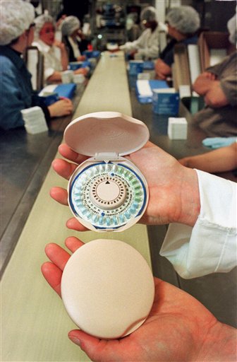 This May 28, 1999, file photo shows a new birth control pill container designed to look like a woman's makeup compact for Ortho-McNeil Pharmaceutical Inc., of Raritan, N.J., displayed at the manufacturer's assembly line. More than half of privately insured women are getting free birth control due to President Barack Obamas health care law, part of a big shift thats likely to continue despite the Supreme Court allowing some employers with religious objections to opt out. (AP Photo/Mike Derer, File)