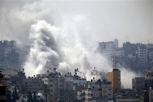 Smoke from an Israeli strike rises over Gaza City, Wednesday, July 23, 2014. Israeli troops battled Hamas militants on Wednesday near a southern Gaza Strip town, sending Palestinian residents fleeing, as the U.S. secretary of state presses ahead with top-gear efforts to end the conflict that has killed hundreds of Palestinians and tens of Israelis. (AP Photo)