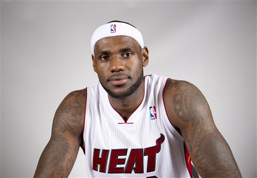 This Sept. 30, 2013, file photo shows Miami Heat basketball player player LeBron James posed during the team's media day in Miami. Four years after their messy breakup, the Cavaliers and James are at least talking about a reunion. Cavs officials met with James' agent, Rich Paul, this week about the free-agent superstar's possible return. The sides visited as James continued his family vacation, a person with knowledge of the details told The Associated Press on Thursday night, July 3, 2014. (AP Photo/J Pat Carter, File)