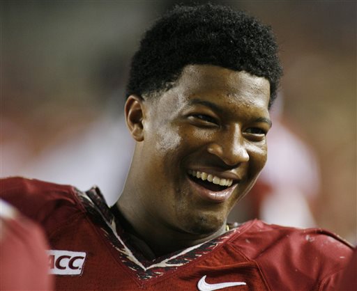 In this Nov. 16, 2013, file photo, Florida State quarterback Jameis Winston (5) smiles on the sidelines in the fourth quarter of an NCAA college football game against Syracuse in Tallahassee, Fla. Winston has the opportunity to accomplish what only one other player has achieved _ win consecutive Heisman trophies.  (AP Photo/Phil Sears, File)