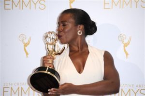 Uzo Aduba poses in the press room with the award for outstanding guest actress in a comedy series for Orange Is the New Black at the 2014 Creative Arts Emmys at Nokia Theatre L.A. LIVE on Saturday, Aug. 16, 2014, in Los Angeles. (Photo by Richard Shotwell/Invision/AP)