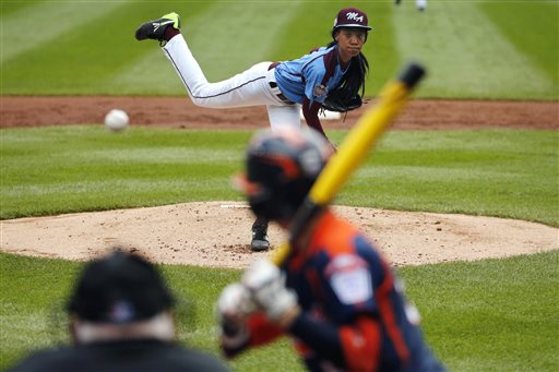 Philadelphia's Mo'ne Davis delivers in the first inning against Nashville's Robert Hassell III during a baseball game in United U.S. pool play at the Little League World Series tournament in South Williamsport, Pa., Friday, Aug. 15, 2014. Philadelphia won 4-0 with Davis pitching a two-hitter. AP Photo/Gene J. Puskar)