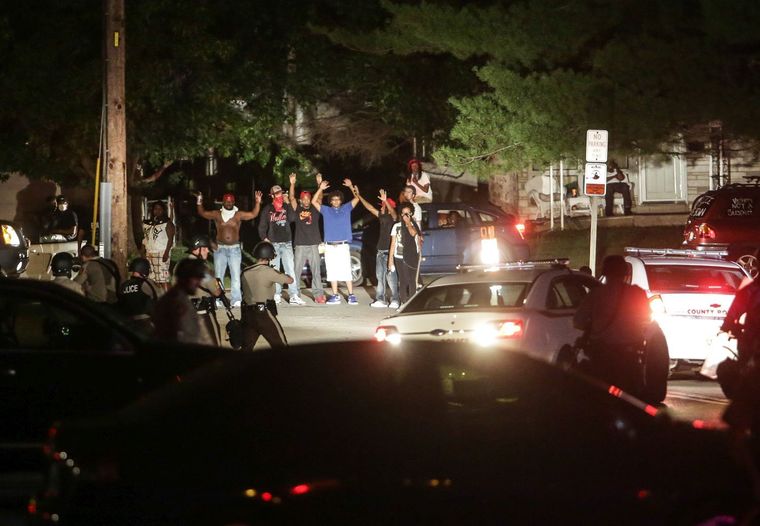 Police point guns at peaceful protesters in Ferguson (Lawrence Bryant/St. Louis American)