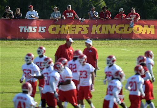 In this Aug. 14, 2014, file photo, Kansas City Chiefs fans watch NFL football practice on the Missouri Western State University campus in St. Joseph. Mo. By making fans feel as though theyre part of the team, and offering gifts and experiences exclusive to members, the Chiefs have managed to expand their season ticket sales at a time when many franchises are having a hard time filling their stadiums. (AP Photo/St. Joseph News-Press, Todd Weddle, File)