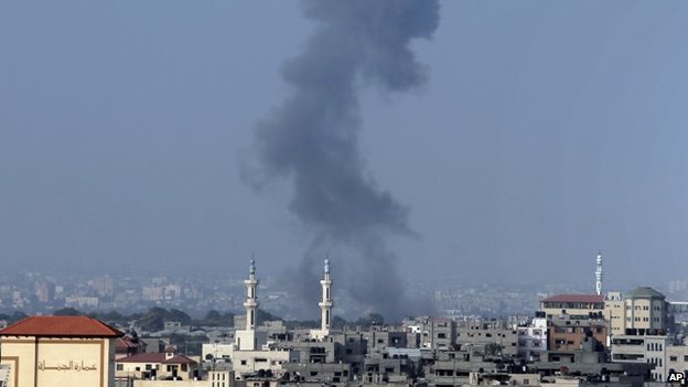 Smoke over Gaza where Israeli forces staged raids shortly before the truce began, while militants fired rockets into Israel ahead of the ceasefire. (AP Photo)