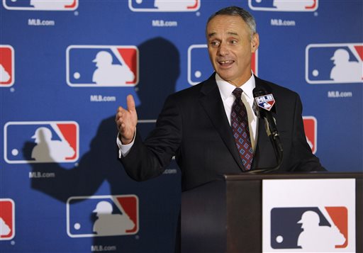 Major League Baseball Chief Operating Officer Rob Manfred speaks to reporters after team owners elected him as the next commissioner of Major League Baseball during an owners quarterly meeting in Baltimore, Thursday, Aug. 14, 2014. (AP Photo/Steve Ruark)