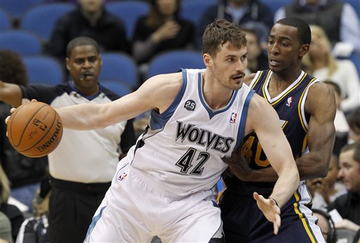 In this April 16, 2014 file photo, Minnesota Timberwolves forward Kevin Love (42) drives against Utah Jazz forward Jeremy Evans, right, during the first quarter of an NBA basketball game in Minneapolis. Two people with knowledge of the deal tell The Associated Press that Minnesota and Cleveland have agreed to a trade that will send All-Star forward Kevin Love to the Cavaliers for Andrew Wiggins, Anthony Bennett and a future first-round draft pick. The two people spoke Thursday on condition of anonymity because no official agreement can be reached until Aug. 23, when Wiggins, this year's No. 1 draft pick, becomes eligible to be traded. (AP Photo/Ann Heisenfelt, File)