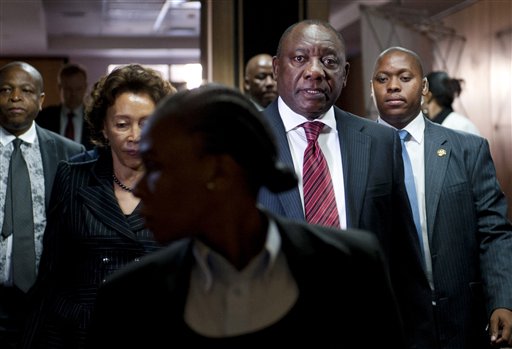This photo taken Monday, Aug. 11 2014 shows newly elected deputy president Cyril Ramaphosa arrives at the Marikana commission of inquiry in Centurion, South Africa. Ramaphosa, a former union leader and businessman testified Monday and Tuesday Aug. 12, 12 2014, before a panel that is investigating the killings of several dozen people who were killed during labor unrest at platinum mine operations in Marikana in 2012. (AP Photo)