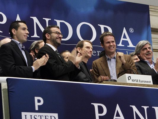Tim Westergren and other Pandora execs ring the NYSE opening bell to celebrate the company's IPO at the New York Stock Exchange in June 2011. (Richard Drew/AP)