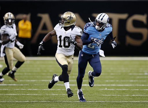 In this Aug. 15, 2014, photo, New Orleans Saints wide receiver Brandin Cooks (10) runes a route against Tennessee Titans cornerback Coty Sensabaugh during an NFL preseason football game in New Orleans. There has been a jump in the number of penalties called for illegal contact, defensive holding and illegal use of hands in preseason games this year. (AP Photo/Bill Haber)