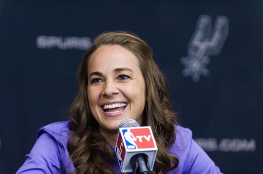WNBA star Becky Hammon takes questions from the media at the San Antonio Spurs practice facility after being introduced as an assistant coach with the team on Tuesday, Aug. 5, 2014 in San Antonio. The San Antonio Spurs hired WNBA star Becky Hammon on Tuesday, making her the first full-time, paid female assistant on an NBA coaching staff.  (AP Photo/Bahram Mark Sobhani)