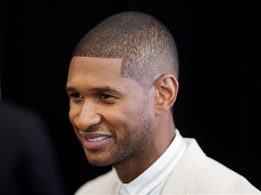 R&B singer Usher attends the 15th anniversary celebration of his New Look Foundation, Thursday, July 31, 2014, in Atlanta. Usher felt overwhelmed by the amount of supporters at his New Look Foundation's 15th year anniversary luncheon. Legendary boxer Sugar Ray Leonard, director Kenny Leon and producer Jermaine Dupri were among the 450-plus attendees at foundation's President's Circle Awards luncheon in downtown Atlanta on Thursday. The nonprofit organization founded by the Grammy-winning singer also celebrated raising $1 million. "This is a passion fuel for me," Usher said Thursday. (AP Photo/David Goldman)