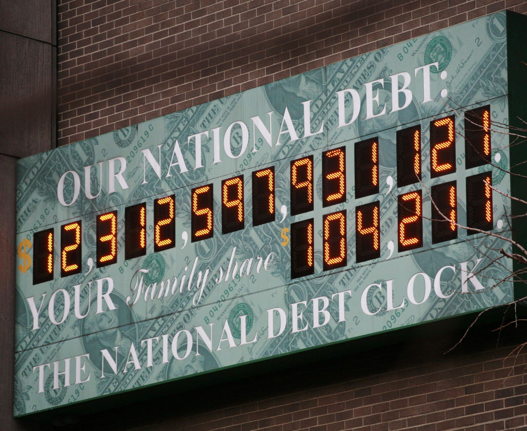The National Debt Clock is shown Monday, Feb. 1, 2010 in New York. President Barack Obama sent Congress a $3.83 trillion budget on Monday that would pour more money into the fight against high unemployment, boost taxes on the wealthy and freeze spending for a wide swath of government programs. The deficit for this year would surge to a record-breaking $1.56 trillion. The Debt Clock is a privately funded estimate of the national debt. (AP Photo/Mark Lennihan)