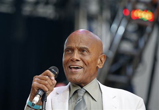 In this July 20, 2014 file photo, singer and activist Harry Belafonte speaks during a memorial tribute concert for folk icon and civil rights activist Pete Seeger at Lincoln Center's Damrosch Park in New York. Belafonte and Maureen O'Hara are among those will be honored by the motion picture academy's board of governors. The academy said Thursday, Aug. 28, 2014, that Belafonte will receive the Jean Hersholt Humanitarian Award at the academy's sixth annual Governors Awards on Nov. 8 in Los Angeles. (AP Photo/Kathy Willens, file)