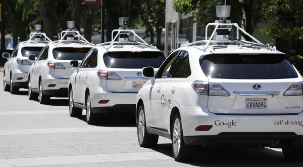 Google self-driving cars are parked May 14 outside the Computer History Museum in Mountain View, Calif. (AP photo)