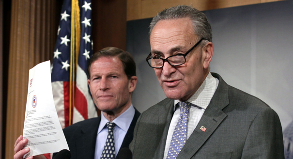 Sen. Charles Schumer, D-N.Y., right, accompanied by Sen. Richard Blumenthal, D-Conn., holds up a letter in opposition to the Paycheck Fairness Act during a news conference on Capitol Hill in Washington, Tuesday, April 8, 2014. (AP Photo/Lauren Victoria Burke)