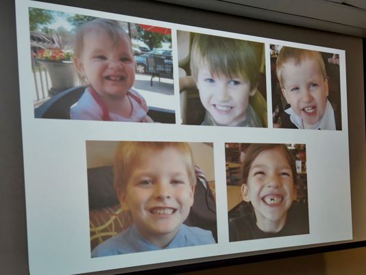 Photos of Timothy Ray Jones Jr.'s children are on display during a news conference at the Lexington County Sheriff's Department Training Center in Lexington, S.C., Sept. 10. Jones, 32, will be charged with murder in the deaths of his five children after he led authorities to a secluded clearing in Alabama, where their bodies were found wrapped in garbage bags. (Richard Shiro/AP)