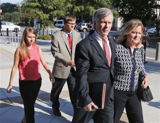 Former Virginia Gov. Bob McDonnell, second left, talks to his sister Eileen Reinamanas they arrive at federal court for the third day of jury deliberations in his corruption trial in Richmond, Va., Thursday, Sept. 4, 2014. McDonnell and his wife Maureen are charged in a 14-count indictment with doing special favors for Jonnie Williams, the CEO of dietary supplements maker Star Scientific Inc., in exchange for $165,000 in gifts and loans. (AP Photo/Steve Helber)