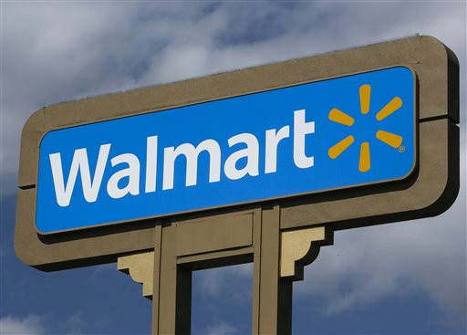 This May 28, 2013, file photo, shows a sign outside a Wal-mart store in Duarte, Calif. Wal-Mart on Wednesday, Sept. 24, 2014 said it is launching a mobile checking account for its customers that will eliminate some of the fees charged by banks. (AP Photo/Damian Dovarganes, File)