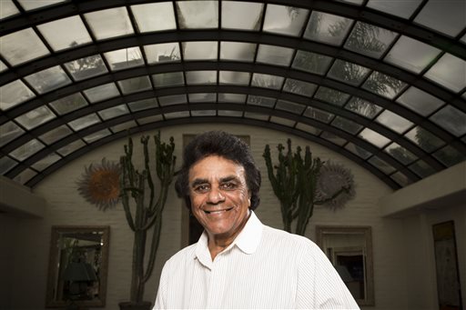 In this Monday, Sept. 8, 2014 photo, singer Johnny Mathis poses for a portrait in Los Angeles. The 78-year-old singer will release a 13-CD box set of unsuccessful commercial albums released from 1963 to 1967, when Mathis left his longtime label, Columbia Records, for Mercury Records and Global Records, his own production company. The Complete Global Albums Collection will be released on Nov. 17. (Photo by Omar Vega/Invision/AP)