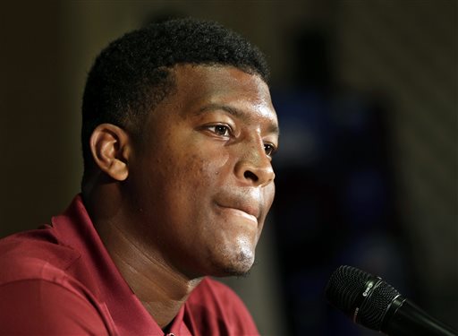 In this July 20, 2014, file photo, Florida State's Jameis Winston answers a question during a news conference at the Atlantic Coast Conference Football kickoff in Greensboro, N.C.  Winston has made lewd comments about women and Florida State coach Jimbo Fisher says he is deciding whether to bench the Seminoles' quarterback for his "derogatory" remarks. Several students tweeted Winston stood on campus Tuesday and shouted a lascivious comment that may have derived from an internet meme. (AP Photo/Chuck Burton, File)