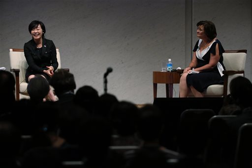 Cherie Blair, right, wife of former British Prime Minister Tony Blair and Akie Abe,  wife of Japanese Prime Minister Shinzo Abe, left, speak during the World Assembly for Women (WAW! Tokyo 2014) at Japan Business Federation in Tokyo, Friday, Sept. 12, 2014. Japan convenes a summit of high-powered women, including IMF chief Christine Lagarde as the government underscores its commitment to redressing the country's conspicuous and costly gender gap. (AP Photo/Eugene Hoshiko)