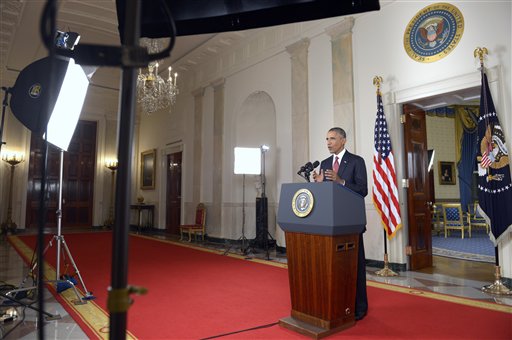 President Barack Obama addresses the nation from the Cross Hall in the White House in Washington, Wednesday, Sept. 10, 2014. In a major reversal, Obama ordered the United States into a broad military campaign to degrade and ultimately destroy militants in two volatile Middle East nations, authorizing airstrikes inside Syria for the first time, as well as an expansion of strikes in Iraq.  (AP Photo/Saul Loeb, Pool)