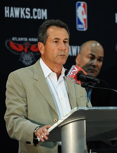 In this June 25, 2012, file photo, Atlanta Hawks co-owner Bruce Levenson introduces new Hawks president of operations and general manager Danny Ferry, right,  during a news conference in Atlanta. Ferry has been disciplined by CEO Steve Koonin for making racially charged comments about Luol Deng when the team pursued the free agent this year.  Ferry apologized Tuesday, Sept. 9, 2014,  for repeating comments that were gathered from numerous sources about Deng. Hawks spokesman Garin Narain said that teams investigation of Ferry's comments uncovered the racially inflammatory email written by Levenson. That discovery led to Levensons announcement Sunday, Sept. 7, 2014, that he will sell his controlling share of the team. (AP Photo/The Atlanta Journal-Constitution, Johnny Crawford)