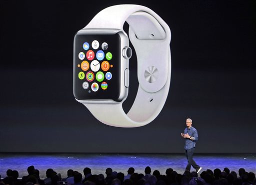 Apple CEO Tim Cook introduces the new Apple Watch on Tuesday, Sept. 9, 2014, in Cupertino, Calif. Apple's new wearable device marks the company's first major entry in a new product category since the iPad's debut in 2010. (AP Photo/Marcio Jose Sanchez)