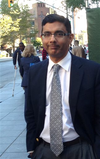 Dinesh D'Souza leaves federal court in New York, Tuesday, Sept. 23, 2014 after being sentenced to spend eight months in community confinement and undergo therapeutic counseling for arranging straw donors for a Senate candidate. D'Souza was spared from prison even though U.S. District Judge Richard M. Berman said the defendant continues to deflect responsibility and minimize his crime. (AP Photo/Larry Neumeister)