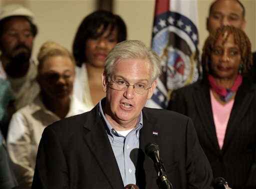 In this Aug. 16, 2014 file photo Missouri Gov. Jay Nixon speaks at a news conference in Ferguson, Mo., dealing with the aftermath of the police shooting of Michael Brown. Nixon was flying out of St. Louis around noon on Aug. 9, unaware that at that very moment a white policeman was fatally shooting an unarmed black 18-year-old just a couple of miles from where he had delivered a commencement speech. Nixon couldnt have foreseen what was about to unfold over the coming days, but questions have been raised about whether he could have responded faster. (AP Photo/Charlie Riedel, File)