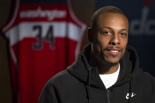 In this Oct. 16, 2014, photo, Washington Wizards NBA basketball player Paul Pierce is interviewed at the Verizon Center in Washington. When Pierce watched the Wizards in last season's playoffs, he saw plenty of talent and potential. He also saw some issues. They needed something. Turns out, Pierce thought they needed ... him. (AP Photo/Cliff Owen)